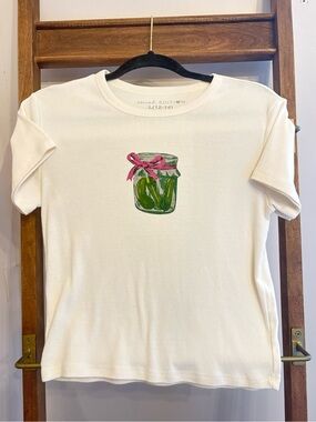 Social Edition Kids Cream Short Sleeve Tee with Pickle Jar Graphic and Pink Bow.